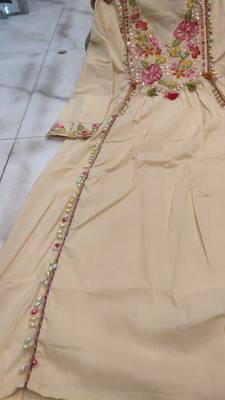 Beautiful  beige anarkali suit set featuring detailed floral thread work and embroidered dupatta. 4