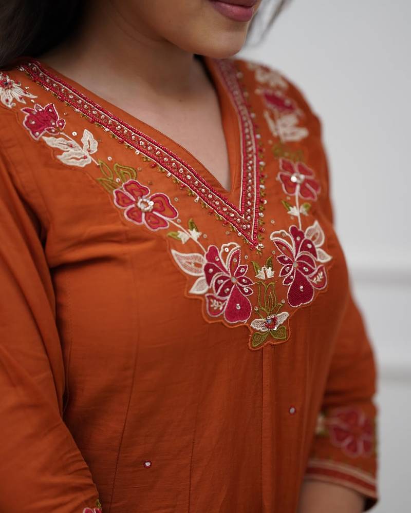 Beautiful  a rust colored embroidered cotton blend anarkali suit set with a dupatta