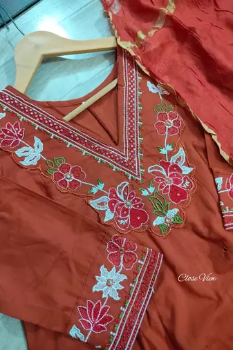 Beautiful  a rust colored embroidered cotton blend anarkali suit set with a dupatta