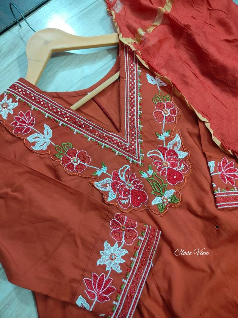 Beautiful  a rust colored embroidered cotton blend anarkali suit set with a dupatta