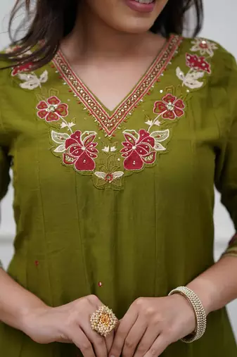 Beautiful  a green colored embroidered cotton blend anarkali suit set with a dupatta