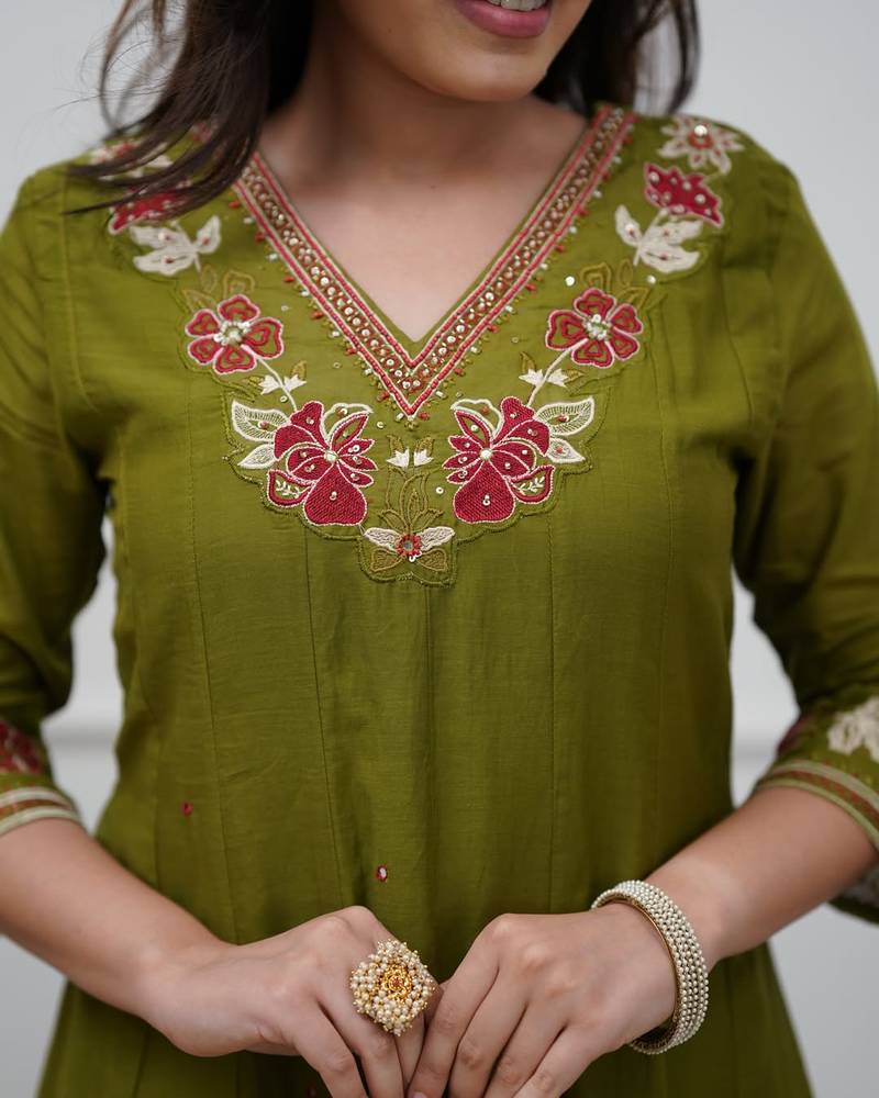 Beautiful  a green colored embroidered cotton blend anarkali suit set with a dupatta