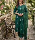 Beautiful  a dark green cotton kurta pant set featuring white floral embroidery and a matching dupatta