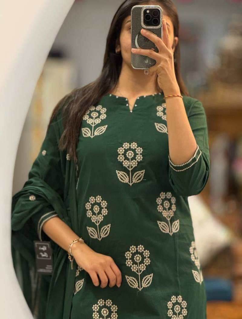 Beautiful  a dark green cotton kurta pant set featuring white floral embroidery and a matching dupatta