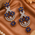 Sapphire bloom cz dangler earrings