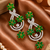 Emerald bloom cz dangler earrings