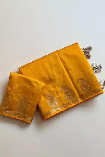 yellow fancy with tassels on pallu tussar silk saree