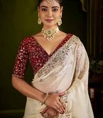 Beige satin silk saree with red embroidered blouse