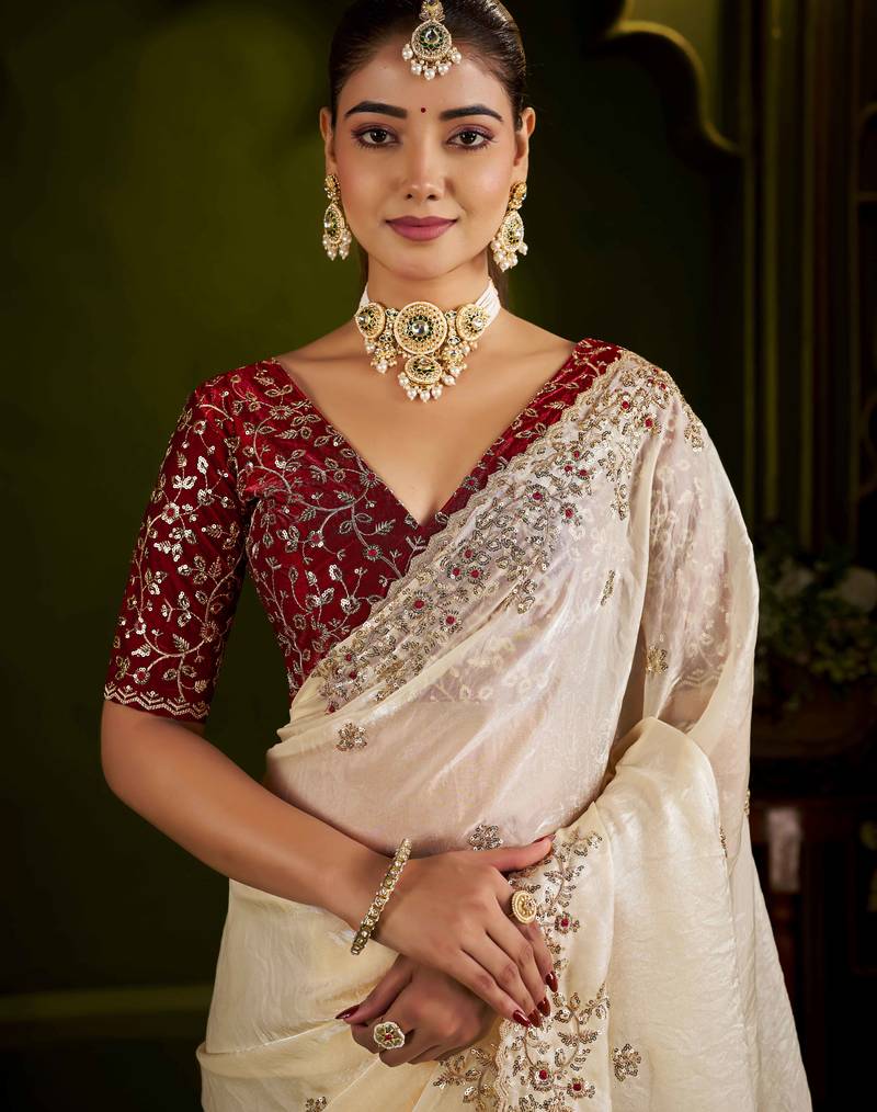 Beige satin silk saree with red embroidered blouse