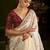 Beige satin silk saree with red embroidered blouse