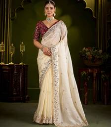 Beige satin silk saree with red embroidered blouse