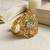 Gold plated cz floral adjustable finger ring