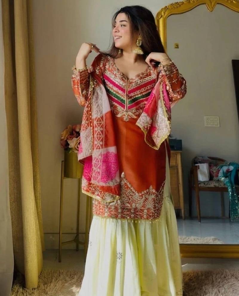 Orange colour satin silk embroidered kurti gharara set with printed tebby dupatta
