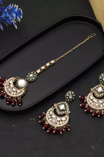 Maroon color kundan earrings tikka set