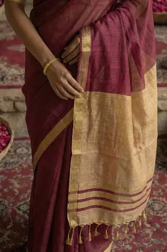 Wine colour handloom cotton saree with contrast border & tassels