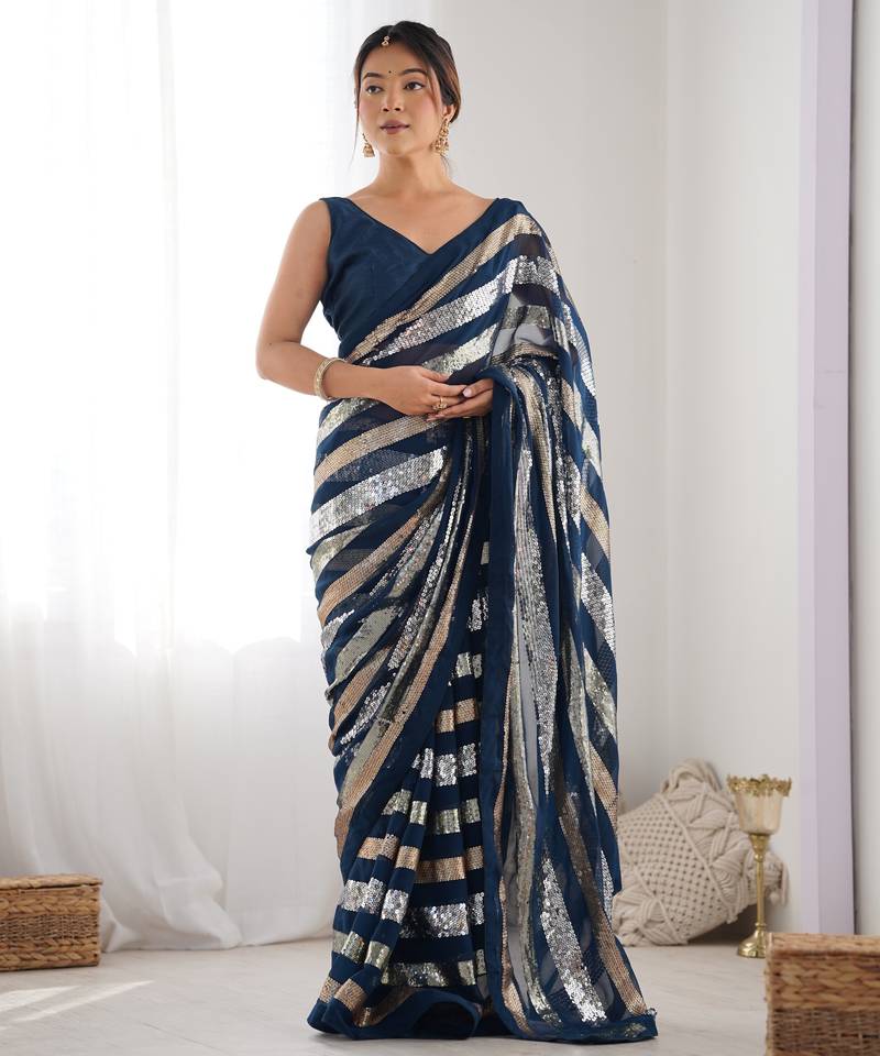 Teal colour heavy georgette sequin saree with blouse