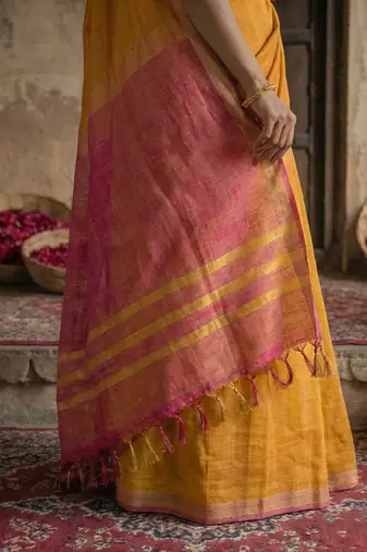 Gold colour handloom cotton saree with contrast border & tassels