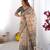 Beige color ready to wear saree with unstich blouse