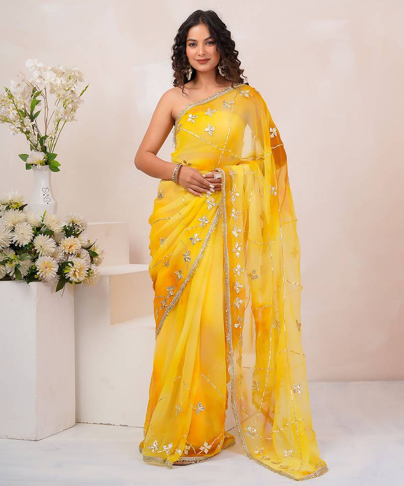 Yellow shaded georgette saree with gota patti jaal work