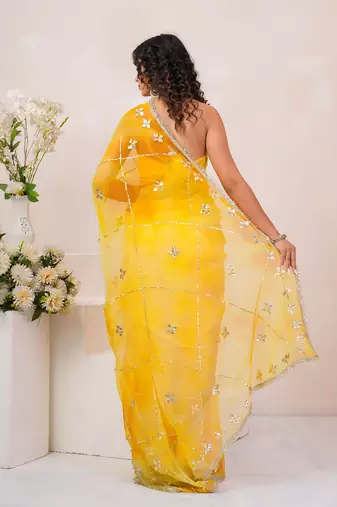 Yellow shaded georgette saree with gota patti jaal work
