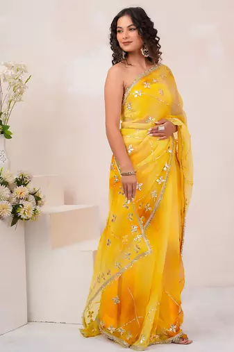 Yellow shaded georgette saree with gota patti jaal work
