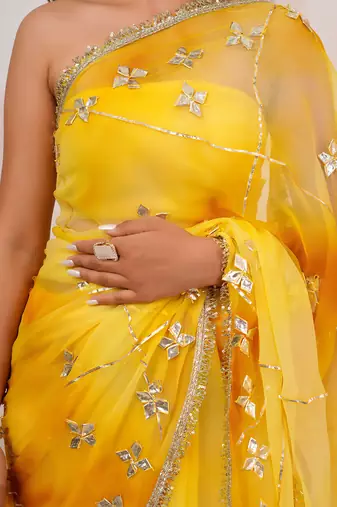 Yellow shaded georgette saree with gota patti jaal work