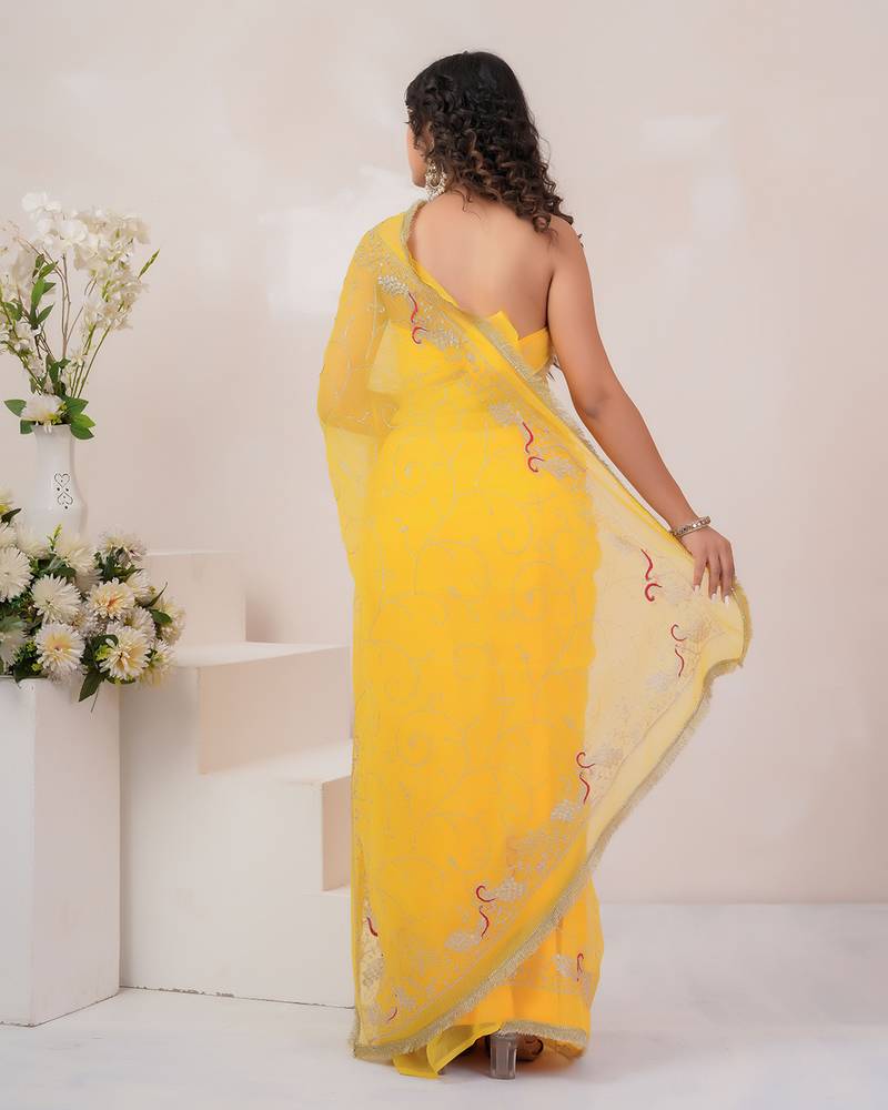 Yellow georgette saree with aari work