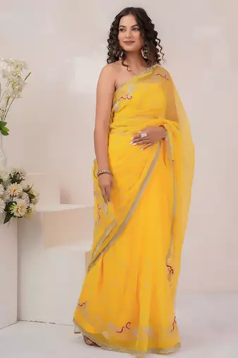 Yellow georgette saree with aari work