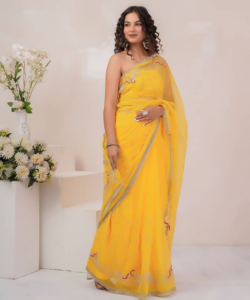 Yellow georgette saree with aari work