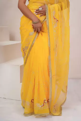 Yellow georgette saree with aari work