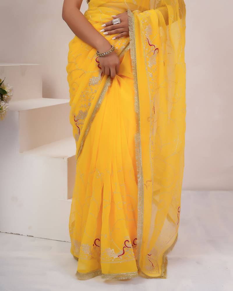 Yellow georgette saree with aari work