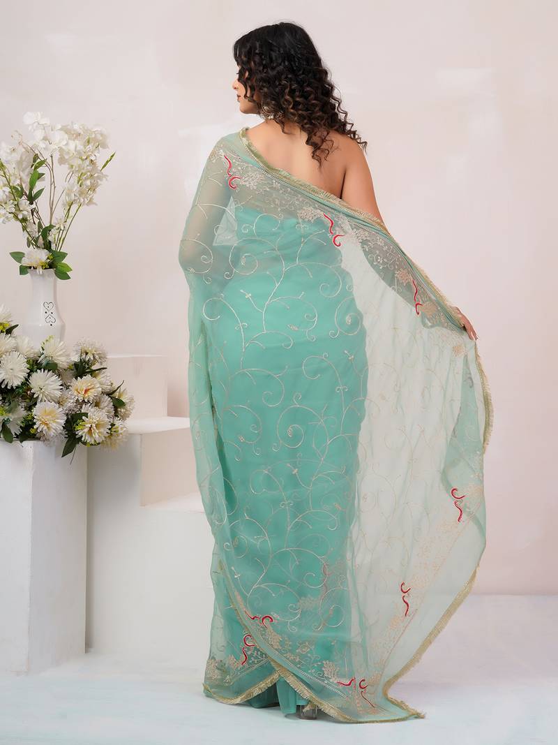 Teal blue georgette saree with aari work