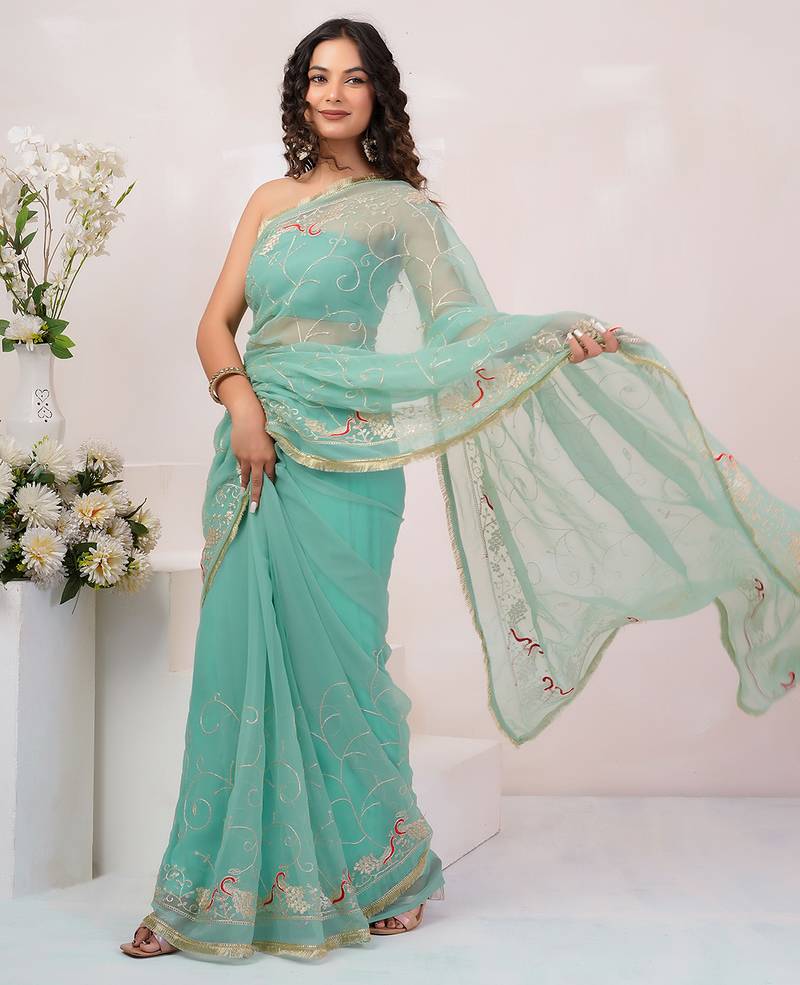 Teal blue georgette saree with aari work