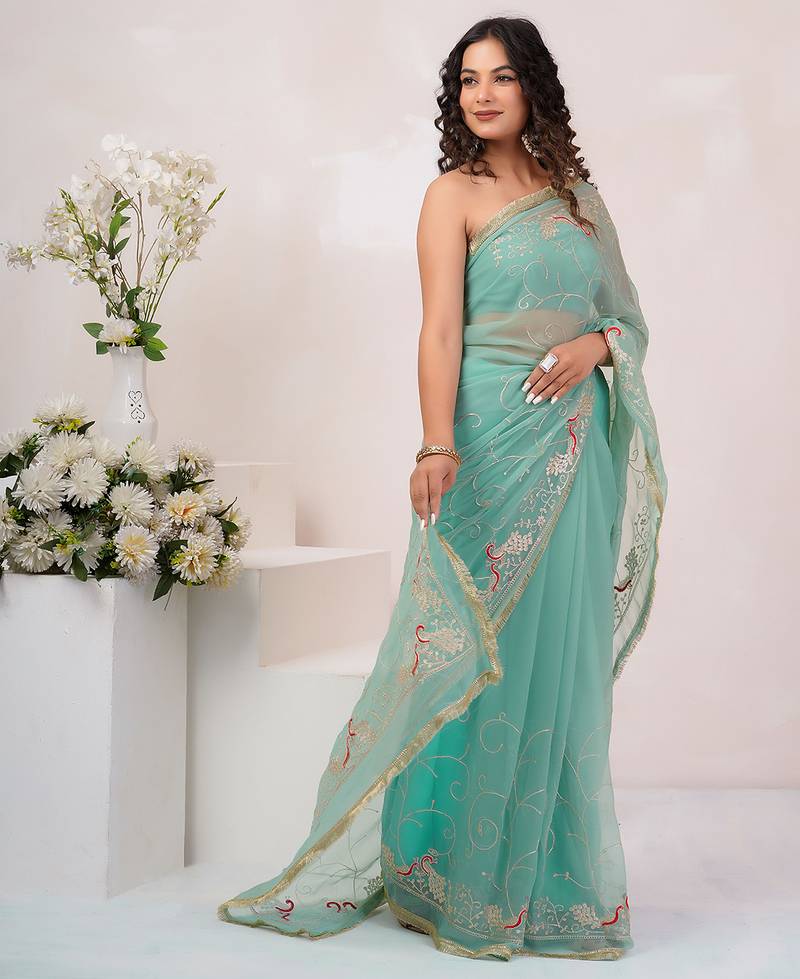 Teal blue georgette saree with aari work