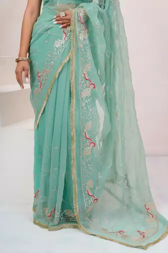 Teal blue georgette saree with aari work