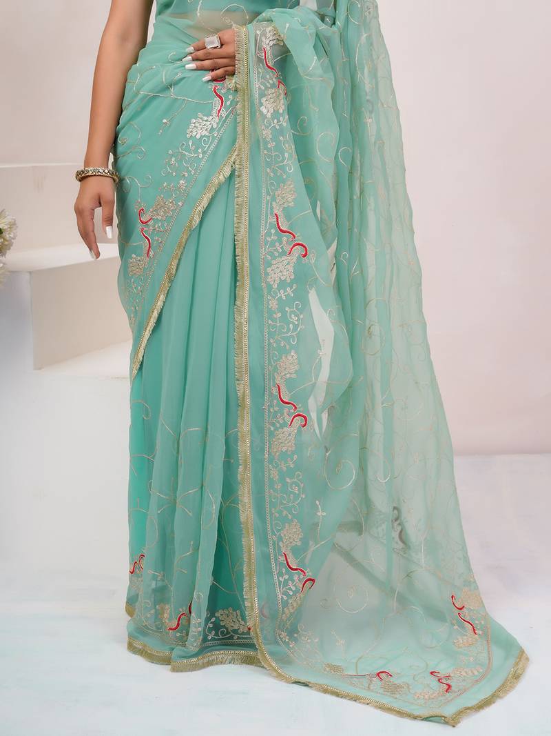 Teal blue georgette saree with aari work