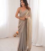 Beige colour fendy satin embroidered lace border saree