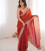 Orange colour fendy satin embroidered lace border saree