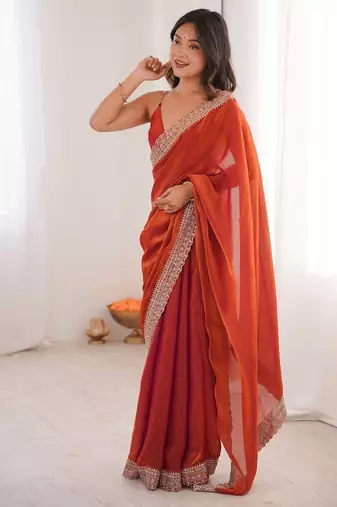 Orange colour fendy satin embroidered lace border saree
