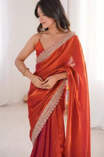 Orange colour fendy satin embroidered lace border saree