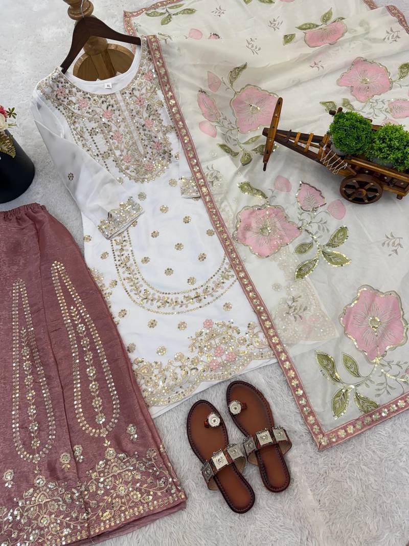 Pink colour pure gmy silk embroidered palazzo suit set with organza dupatta