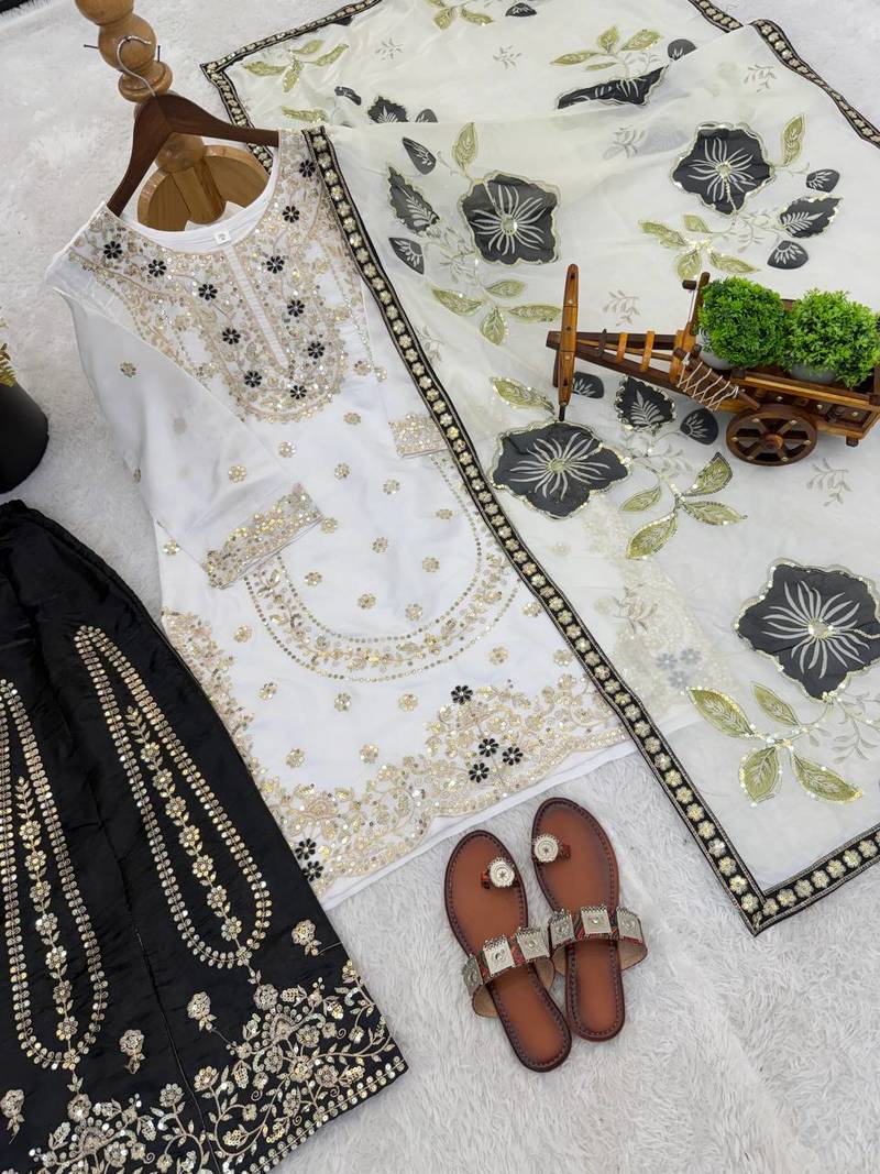 Black colour pure gmy silk embroidered palazzo suit set with organza dupatta