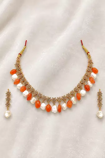 Gold-toned necklace set with orange beads and baroque pearls, ethnic indian jewellery, with earrings