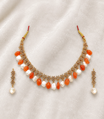 Gold-toned necklace set with orange beads and baroque pearls, ethnic indian jewellery, with earrings