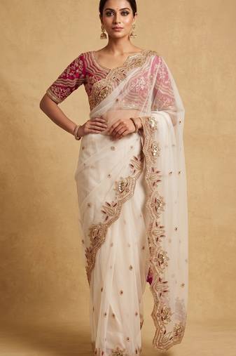White embroidered net designer saree with designer rani pink blouse fabric