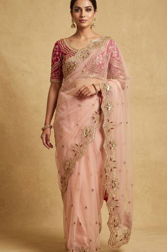 Peach embroidered net designer saree with designer rani pink blouse fabric