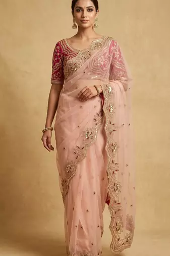 Peach embroidered net designer saree with designer rani pink blouse fabric