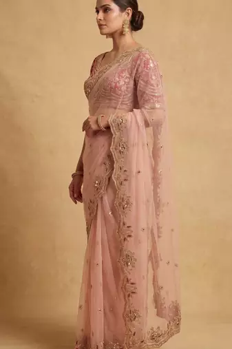 Peach embroidered net designer saree with designer rani pink blouse fabric