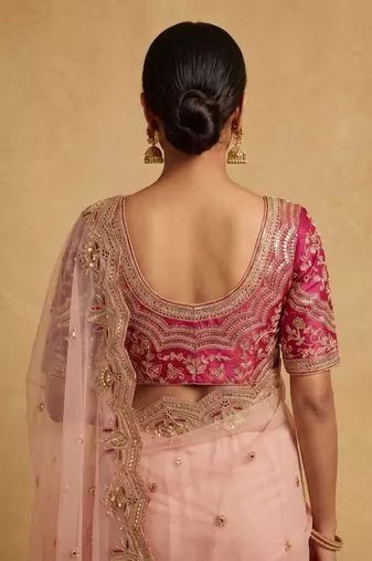 Peach embroidered net designer saree with designer rani pink blouse fabric