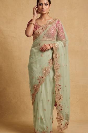 Light green embroidered net designer saree with designer rani pink blouse fabric